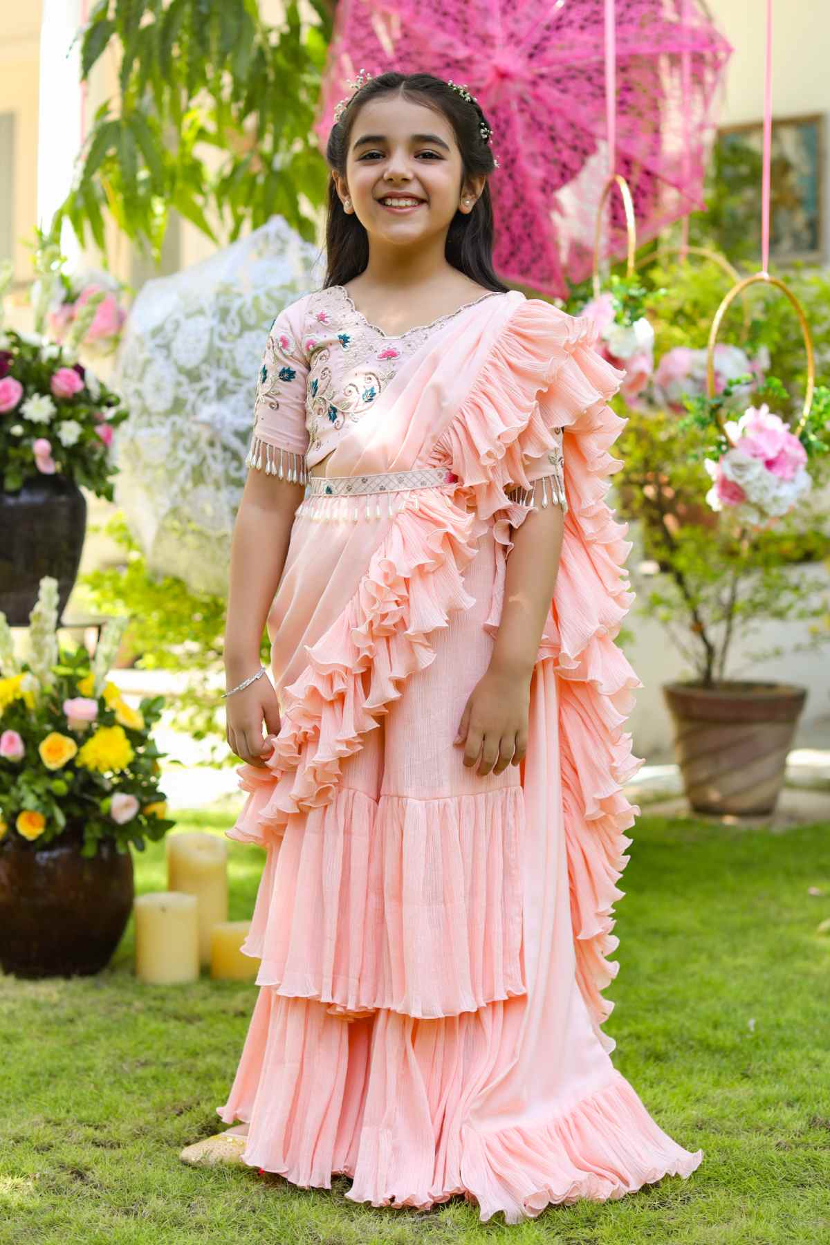 Buy Kids Designer Littleens Sharara saree with tiers and gathers at the hem, floral embellishments on the blouse and belted at the waist with floral and geometric work Online at ScrollnShops